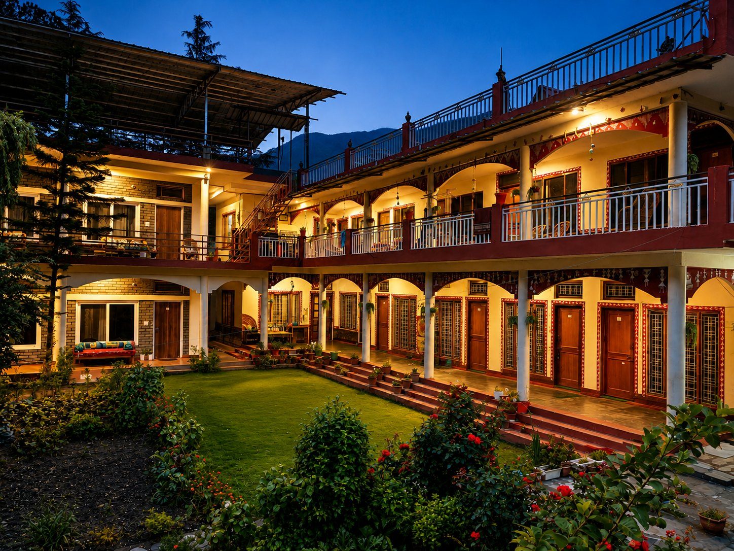 Our residential campus, Anand Ganga, with its courtyard, garden and covered verandas at dusk