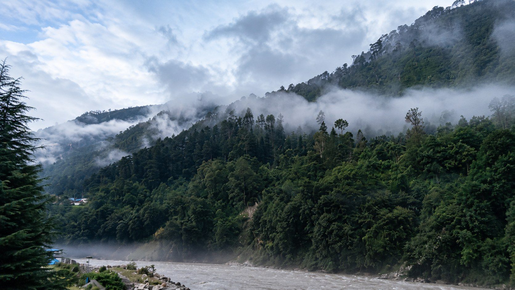 Mist rising over the forested hills and river valley near Uttarkashi