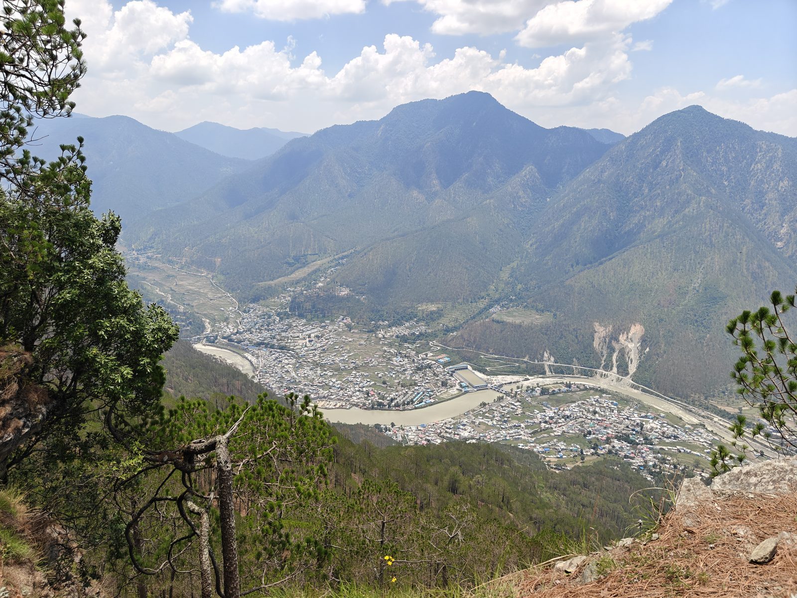 A sweeping view of the Uttarkashi valley, the Bhagirathi river and the surrounding Himalayan peaks