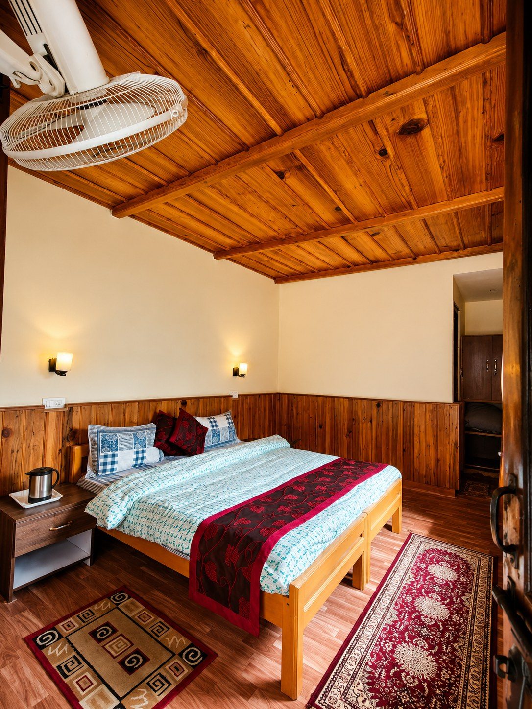 A cosy wood-panelled room at our Uttarkashi campus with warm lighting